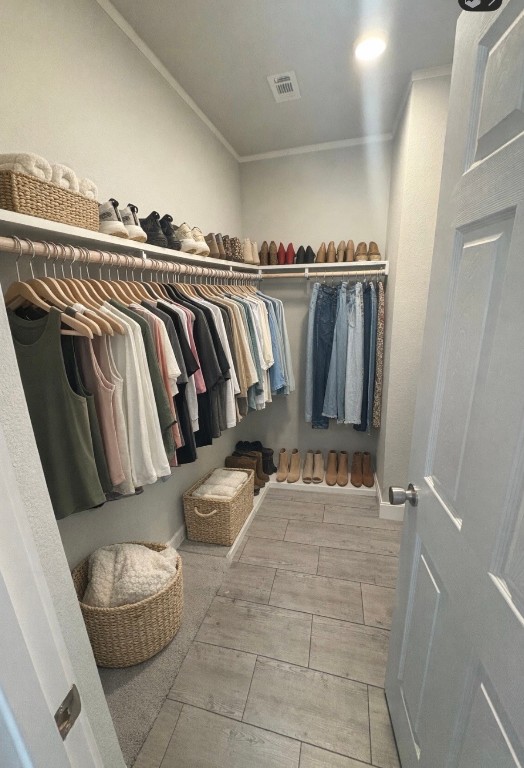 2854 Benny Griffin Road Livingston, TX 77351 - Photo 19 of 19 a view of walk in closet with clothes and shoes