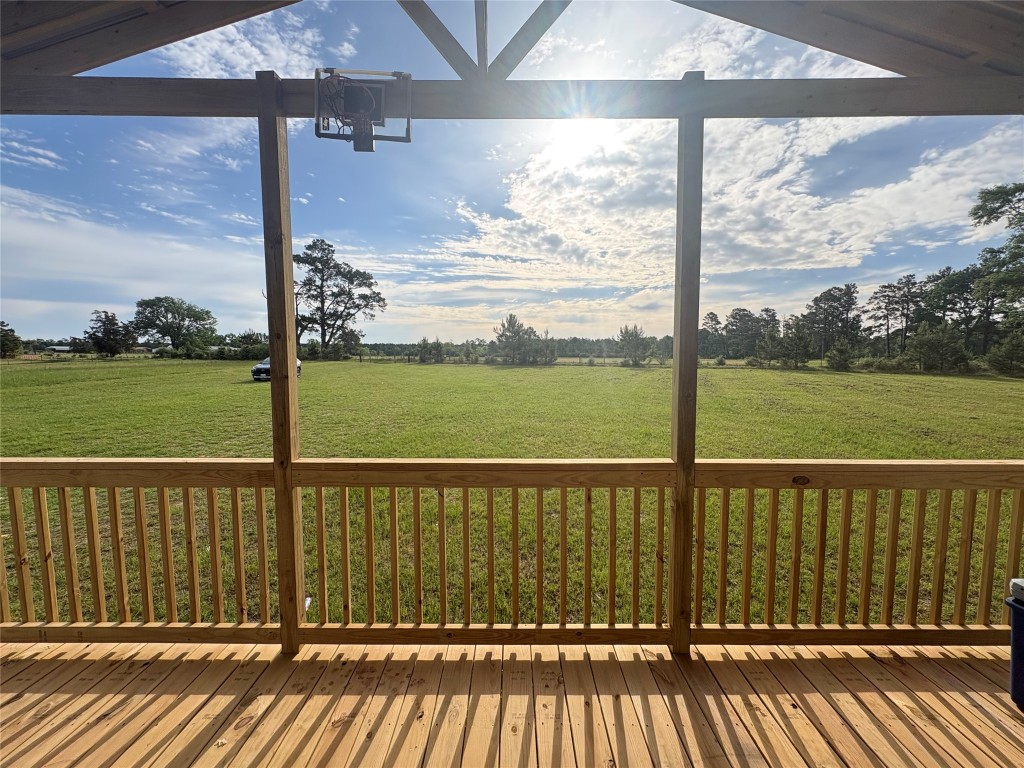 2854 Benny Griffin Road Livingston, TX 77351 - Photo 4 of 19 a view of a wooden balcony