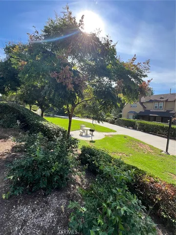 a view of a swimming pool with an outdoor space and seating area