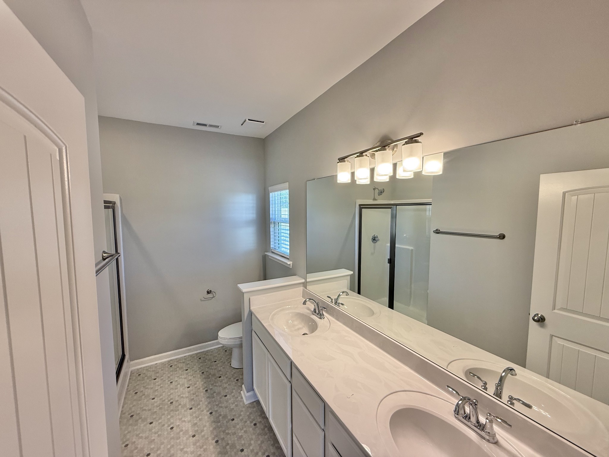 53 Ellie Jan Way Manchester, TN 37355 - Photo 7 of 11 a spacious bathroom with a double vanity sink mirror and shower