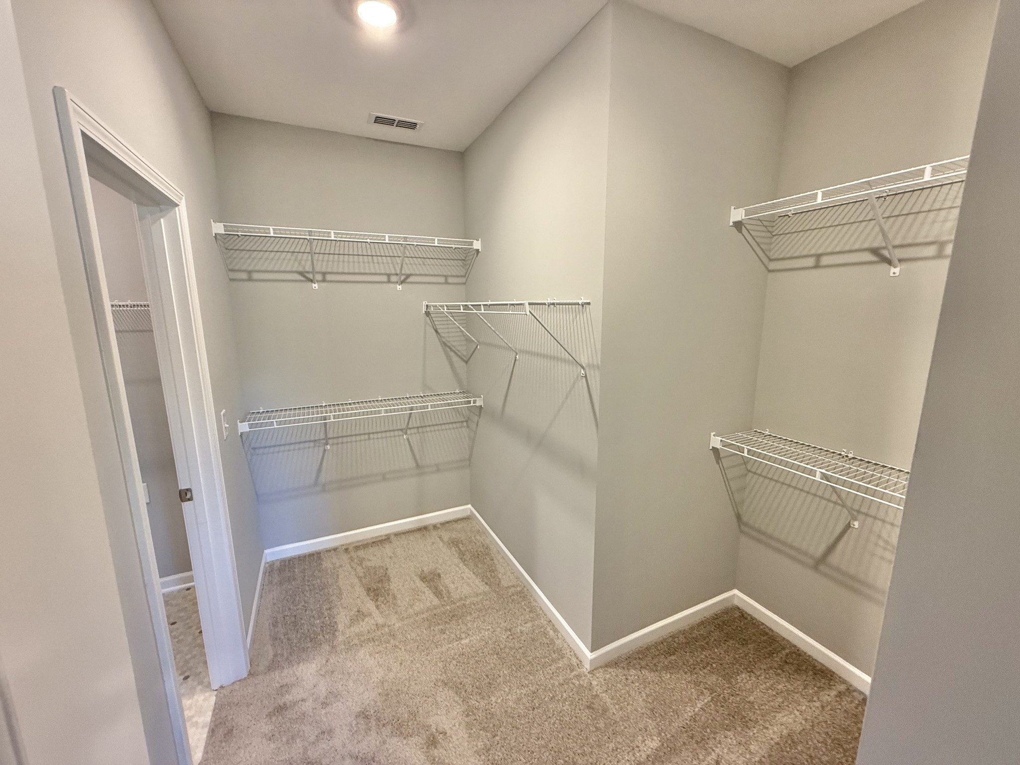 53 Ellie Jan Way Manchester, TN 37355 - Photo 8 of 11 a view of a room with racks on the wall