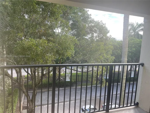 a balcony with wooden floor and fence