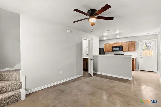 a view of a kitchen with a sink and cabinet