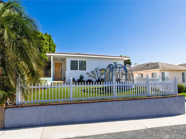 a view of a house with a wooden deck