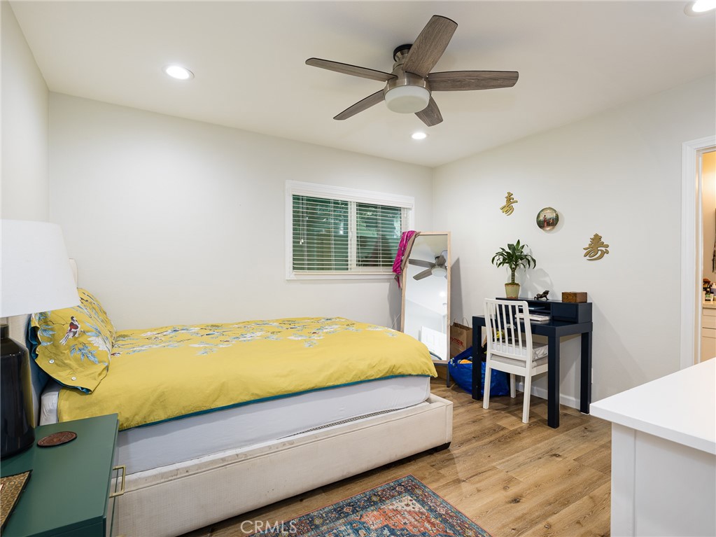 526 Sheldon Street El Segundo, CA 90245 - Photo 13 of 41 a bed room with a bed and a chandelier