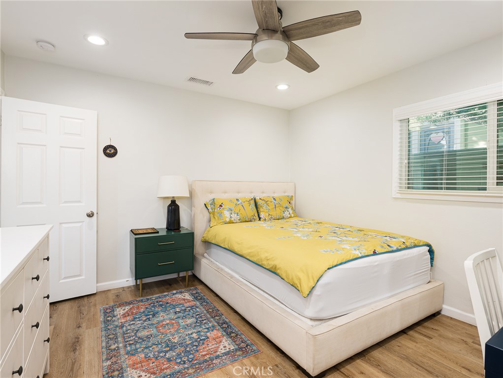 526 Sheldon Street El Segundo, CA 90245 - Photo 14 of 41 a bedroom with a bed and a chandelier