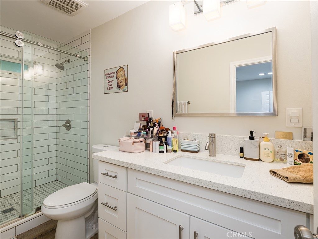 526 Sheldon Street El Segundo, CA 90245 - Photo 15 of 41 a bathroom with a sink vanity mirror and toilet