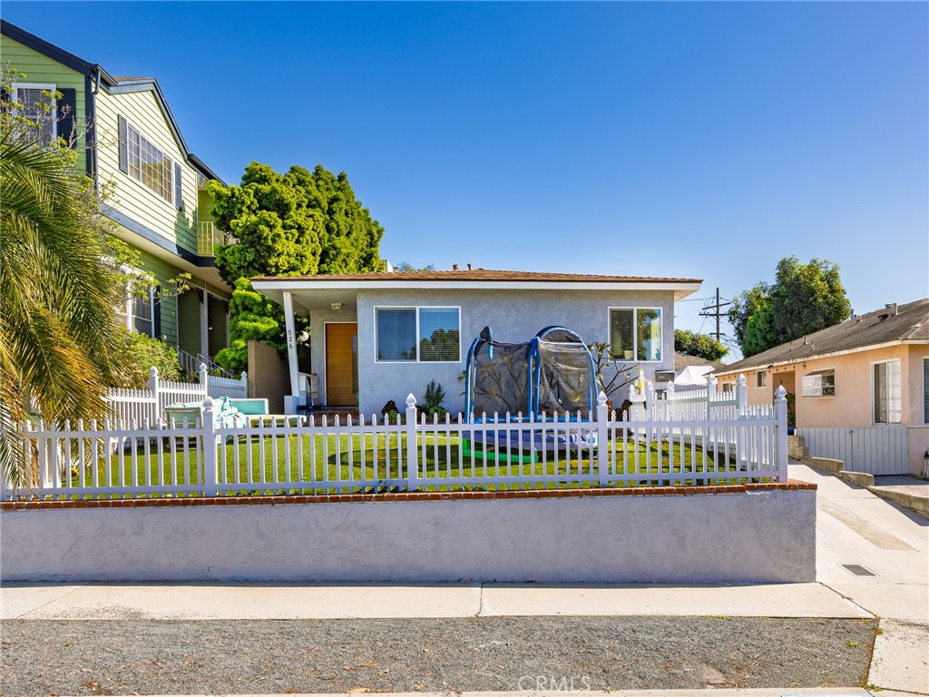526 Sheldon Street El Segundo, CA 90245 - Photo 2 of 41 a front view of a house with a garden