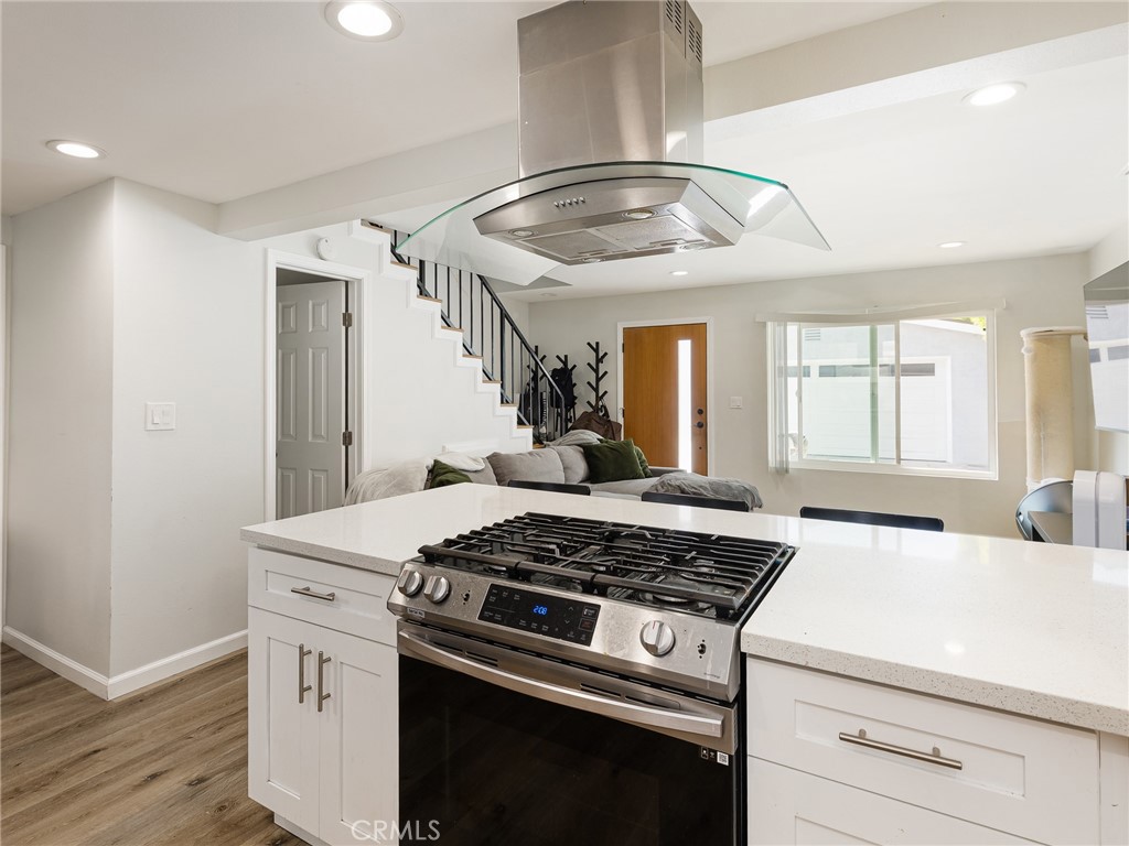 526 Sheldon Street El Segundo, CA 90245 - Photo 27 of 41 a kitchen with a stove and white cabinets