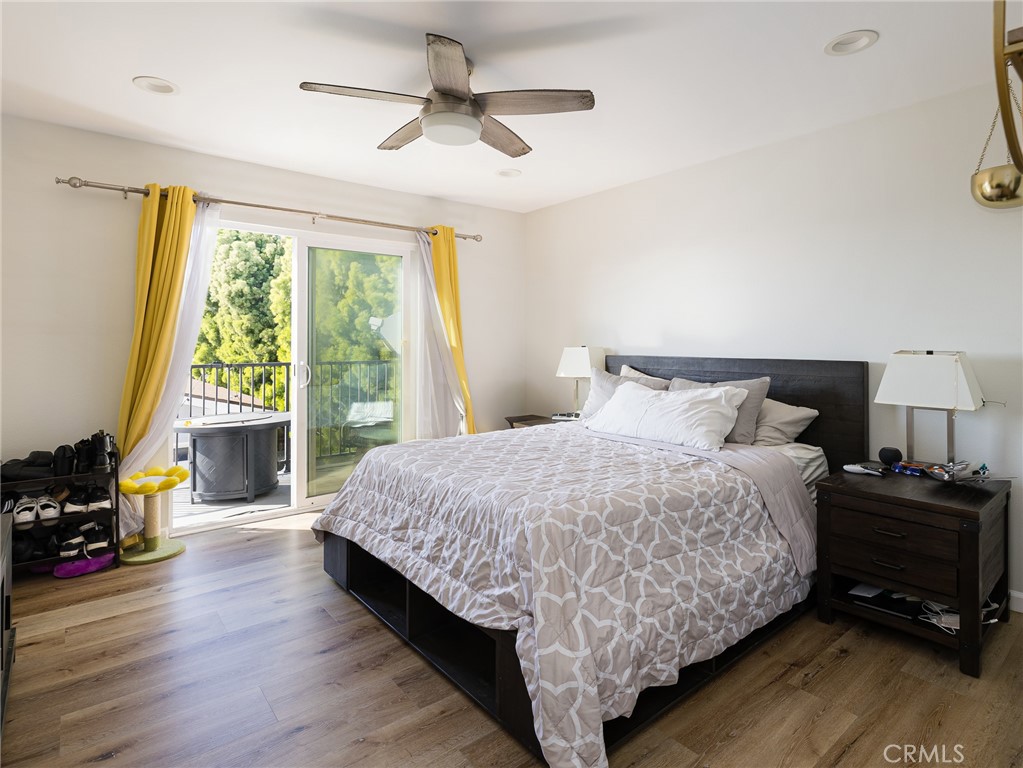 526 Sheldon Street El Segundo, CA 90245 - Photo 30 of 41 a bedroom with a bed a large window and book self