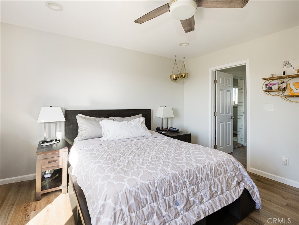 526 Sheldon Street El Segundo, CA 90245 - Photo 32 of 41 a bedroom with a bed and wooden floor
