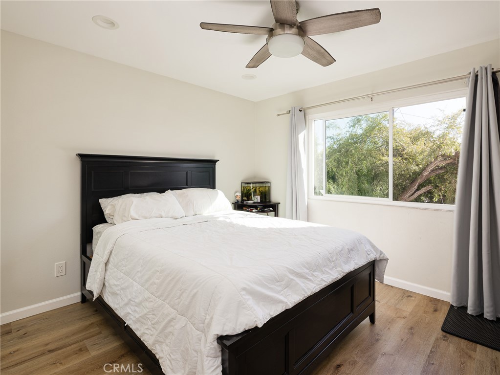 526 Sheldon Street El Segundo, CA 90245 - Photo 35 of 41 a bedroom with a bed and wooden floor