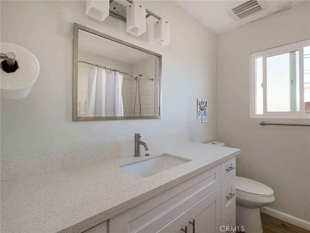526 Sheldon Street El Segundo, CA 90245 - Photo 36 of 41 a bathroom with a sink a toilet and a mirror