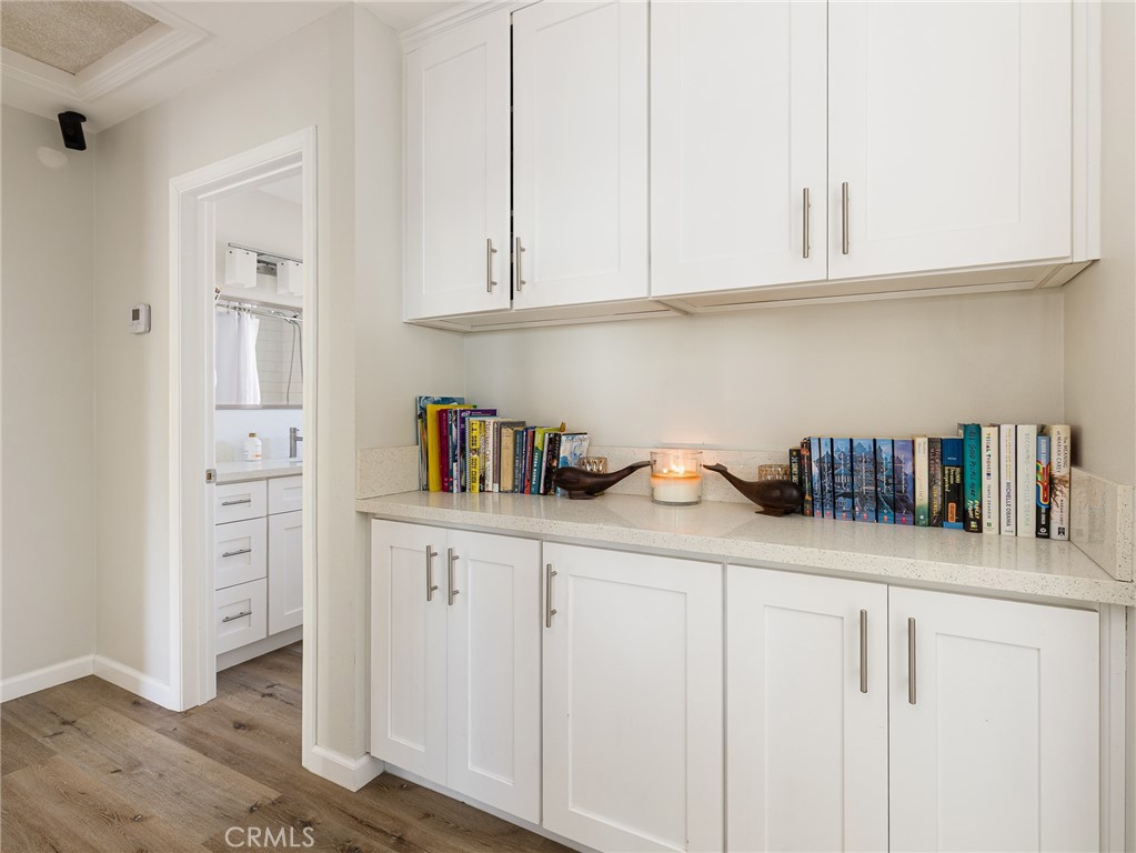 526 Sheldon Street El Segundo, CA 90245 - Photo 37 of 41 a kitchen with cabinets and a wooden floor