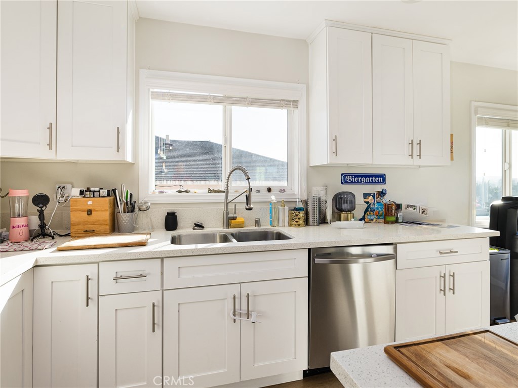 526 Sheldon Street El Segundo, CA 90245 - Photo 10 of 41 a kitchen with white cabinets and white appliances