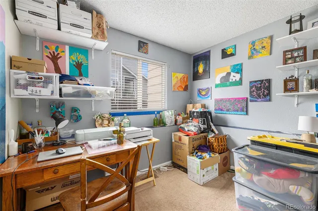 a room with furniture a flat screen tv and a window