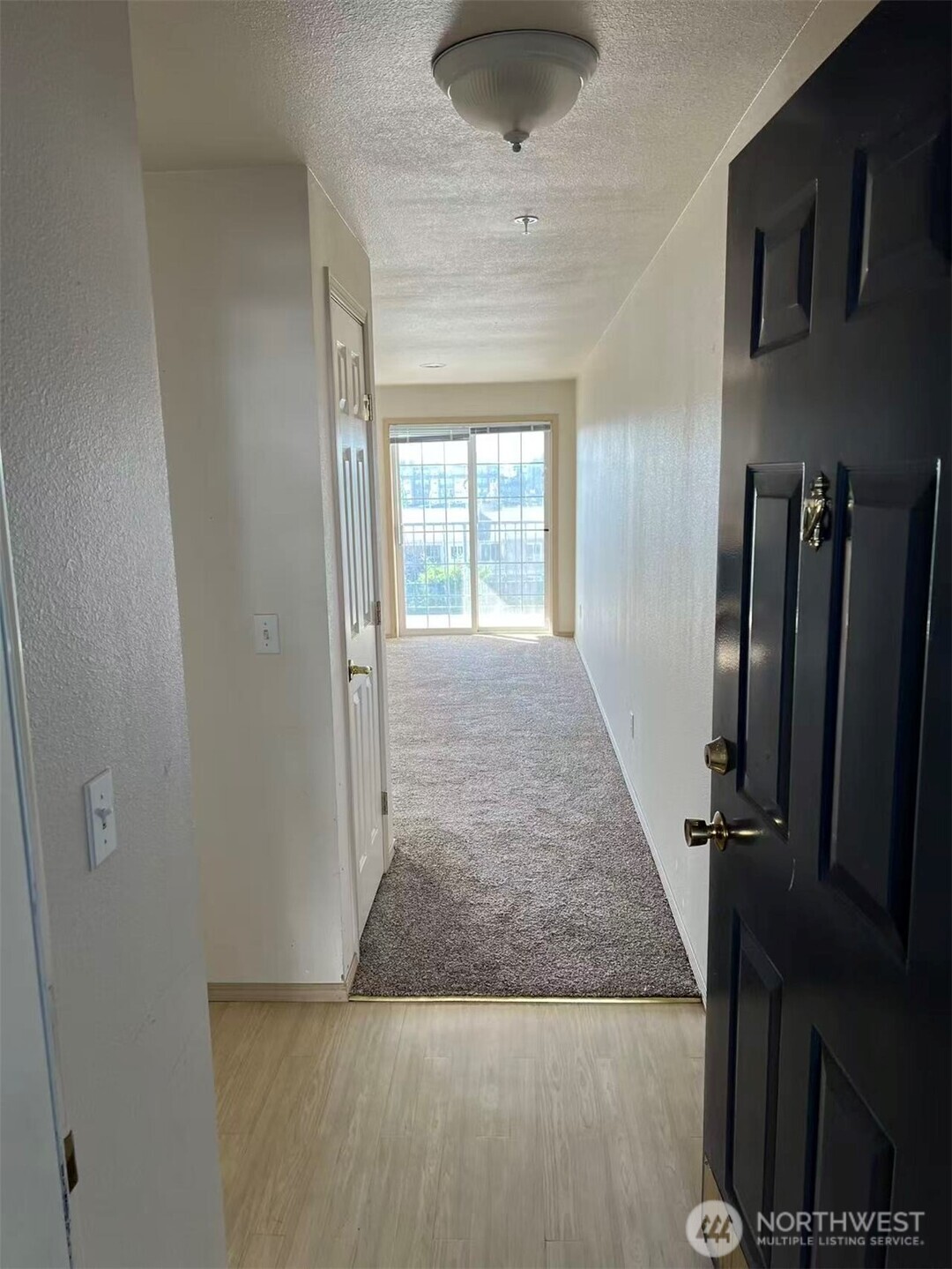 1160 Monroe Avenue Northeast, Unit D3 Renton, WA 98056 - Photo 2 of 15 an entryway with chandelier in front of it
