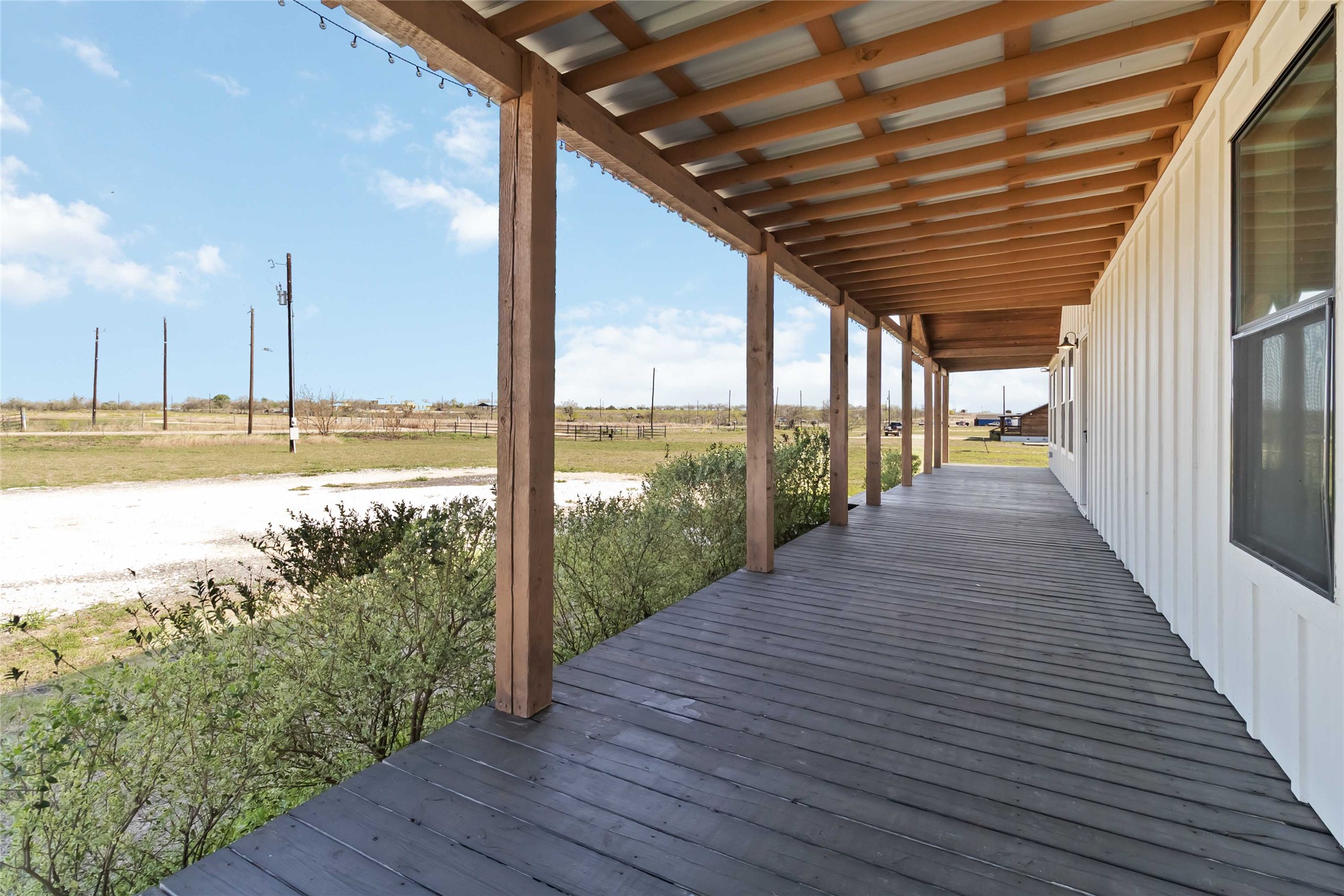 Wooden deck featuring a rural view