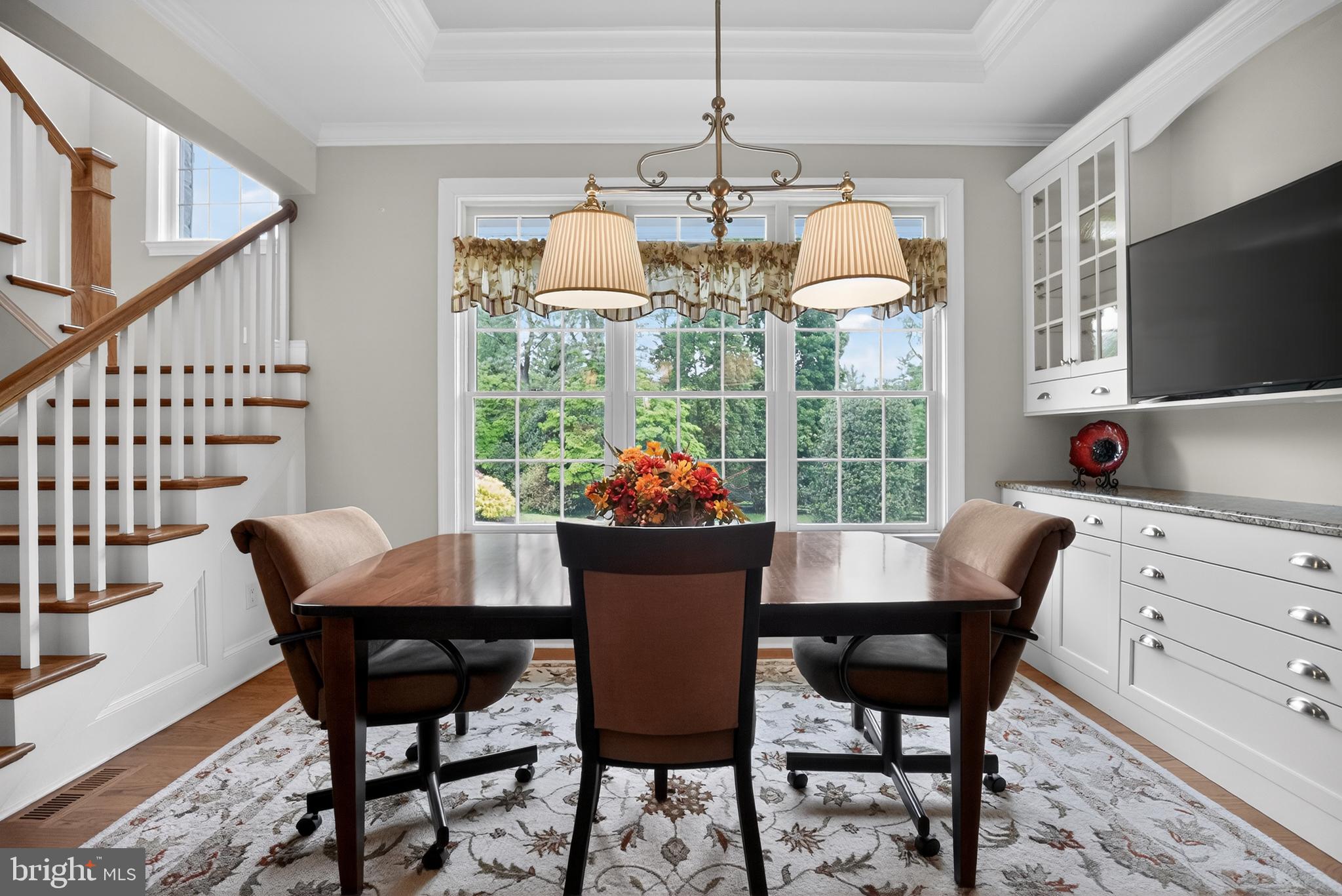 1031 Coates Road Jenkintown, PA 19046 - Photo 22 of 66 a dining room with furniture a chandelier and wooden floor