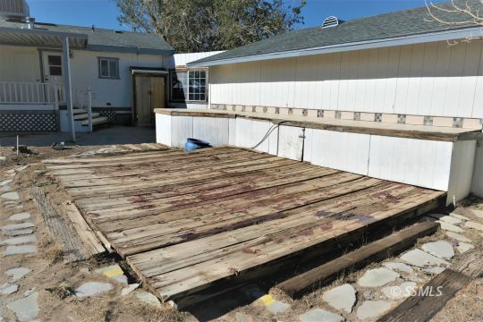 400 South Guam Street Ridgecrest, CA 93555 - Photo 39 of 39 a bed sitting in a kitchen next to a building