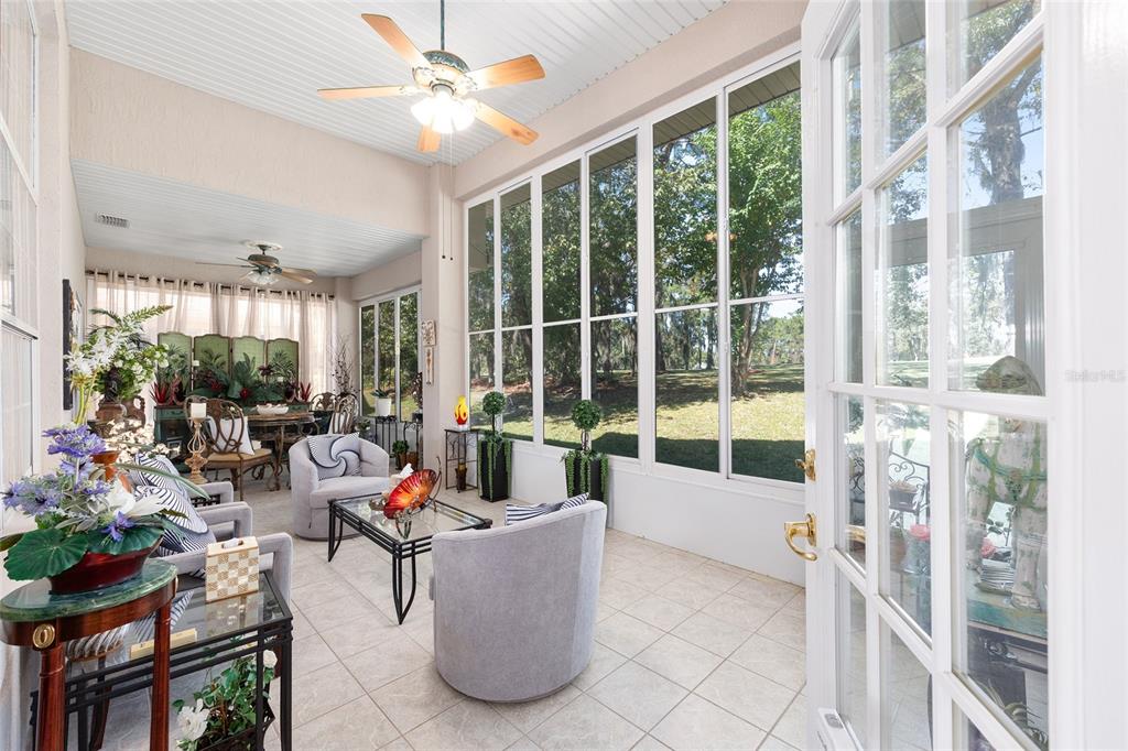 11615 Southwest 72nd Circle Ocala, FL 34476 - Photo 21 of 51 a living room with furniture and a large window