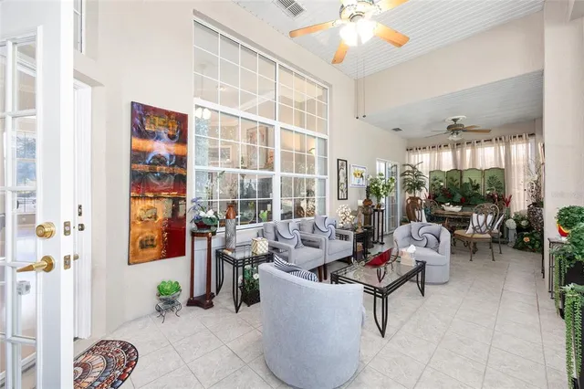 a bedroom with a bed and ceiling fan