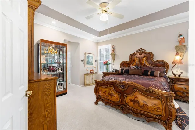 a bed room with a bed and a chair