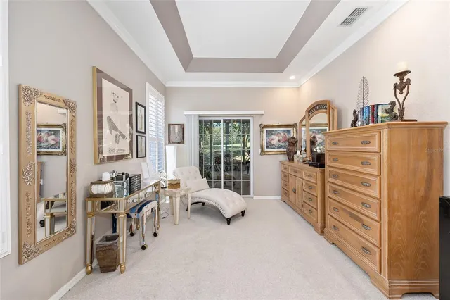 a view of walk in closet with clothes