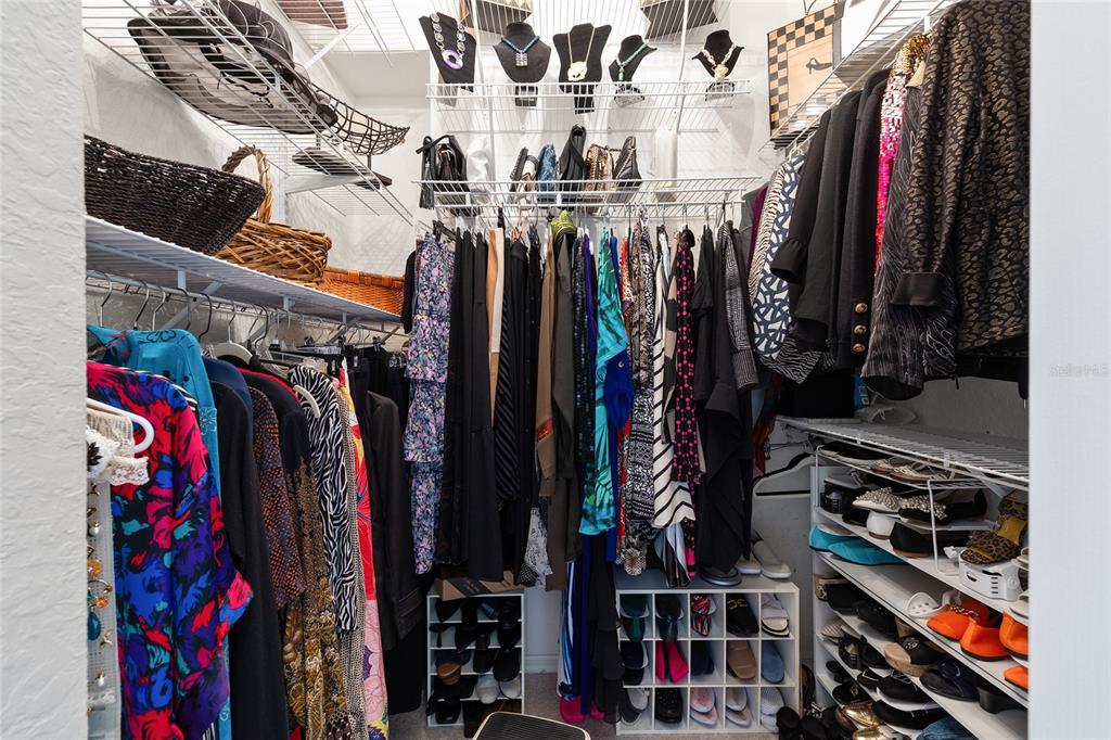 11615 Southwest 72nd Circle Ocala, FL 34476 - Photo 32 of 51 a view of walk in closet with clothes and shoes