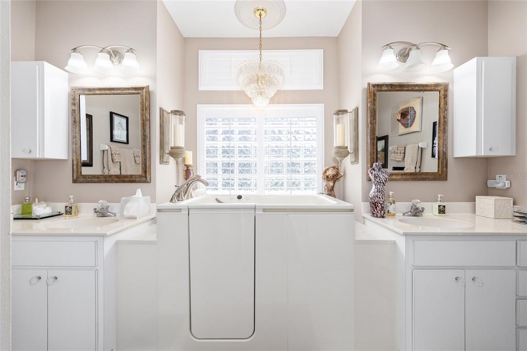 11615 Southwest 72nd Circle Ocala, FL 34476 - Photo 34 of 51 a bathroom with a sink vanity and mirror