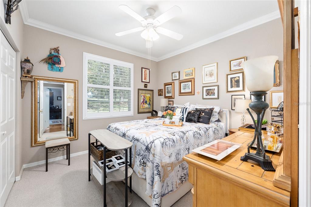 11615 Southwest 72nd Circle Ocala, FL 34476 - Photo 37 of 51 a bed room with furniture and a window