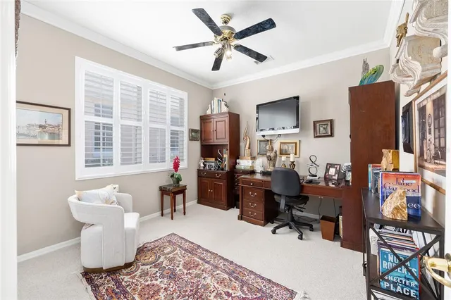 a bedroom with furniture and a rug