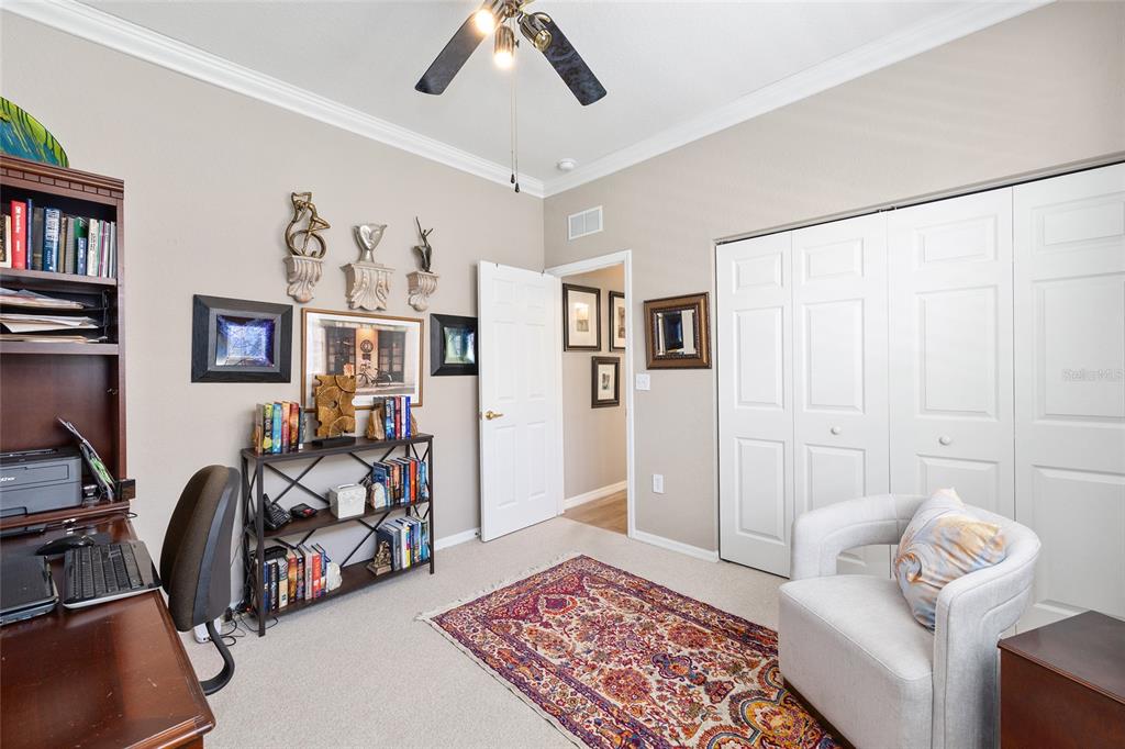 11615 Southwest 72nd Circle Ocala, FL 34476 - Photo 41 of 51 a bedroom with furniture and a rug