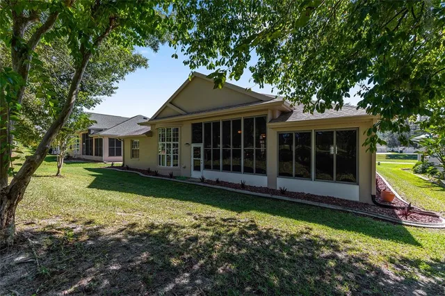 an aerial view of a house with swimming pool and porch