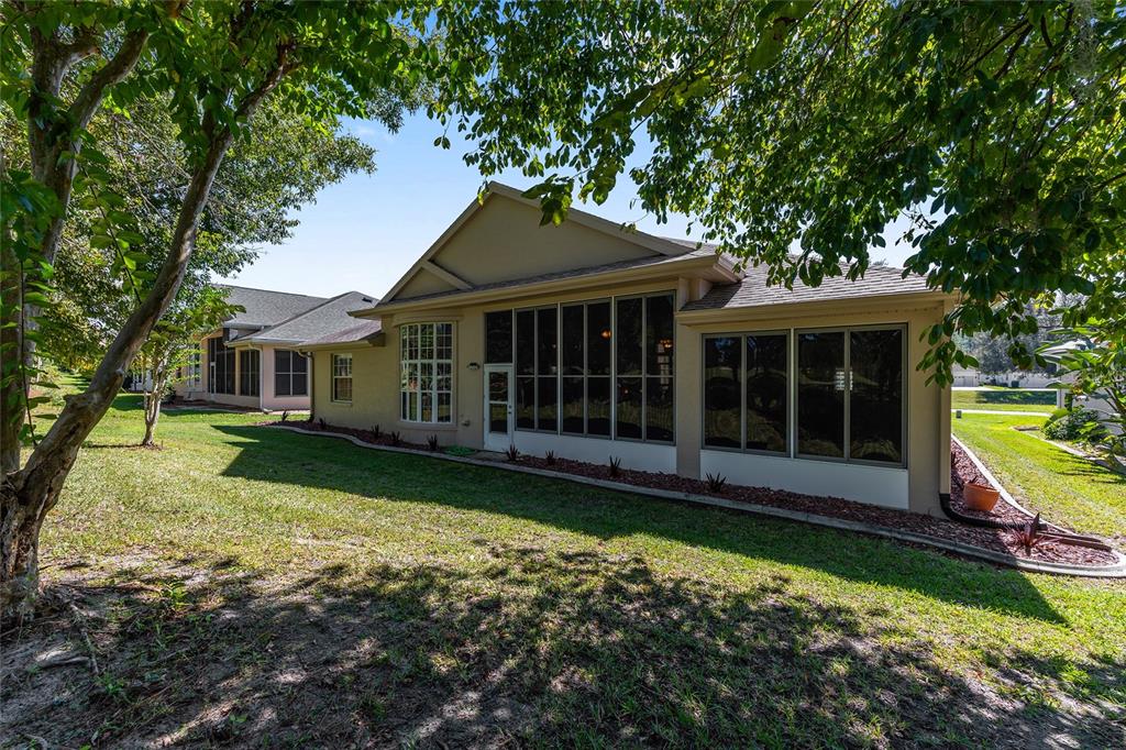 11615 Southwest 72nd Circle Ocala, FL 34476 - Photo 46 of 51 front view of a house with a yard