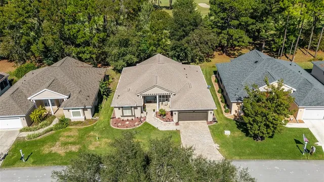an aerial view of house with yard