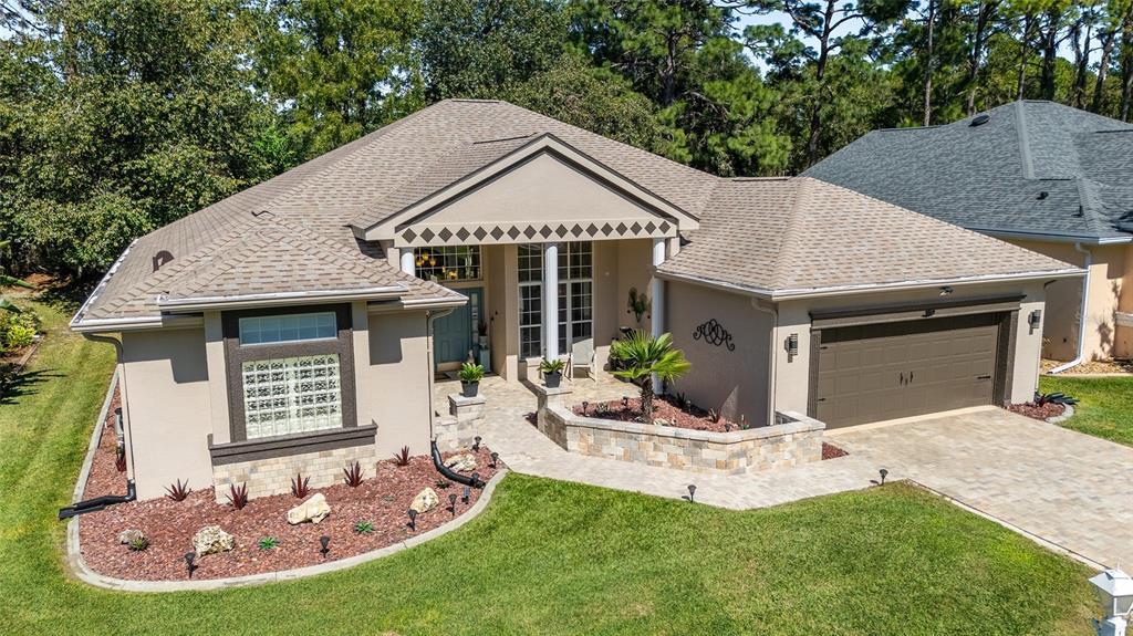 11615 Southwest 72nd Circle Ocala, FL 34476 - Photo 49 of 51 a view of a house with a yard porch and furniture