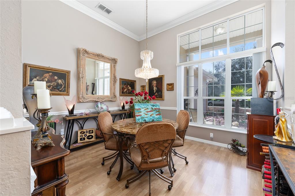 11615 Southwest 72nd Circle Ocala, FL 34476 - Photo 7 of 51 a view of a dining room with furniture window and wooden floor