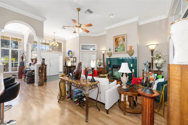 a living room filled with furniture and a fireplace