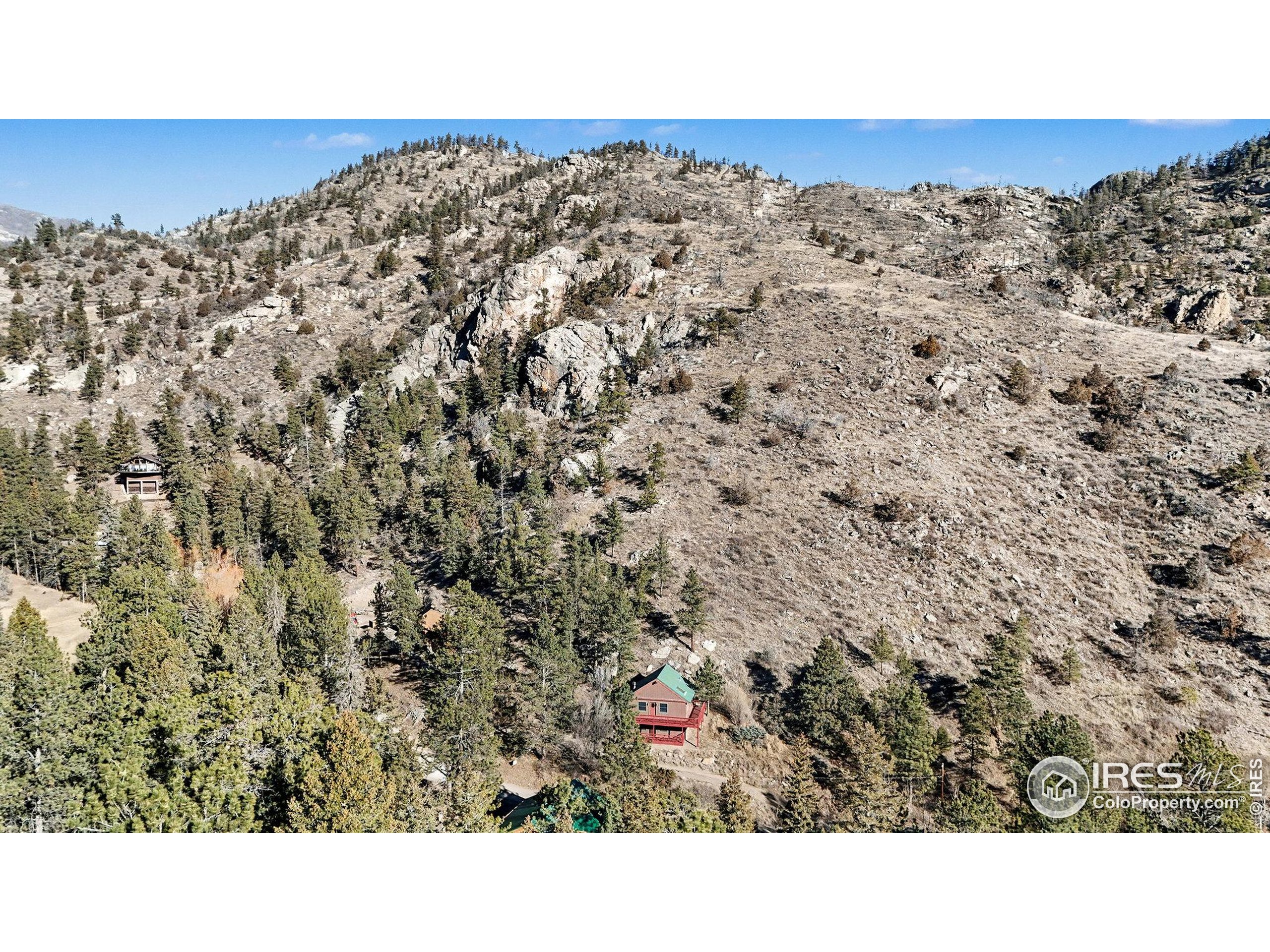 280 Streamside Drive Drake, CO 80515 - Photo 4 of 26 a black and white photo of a road