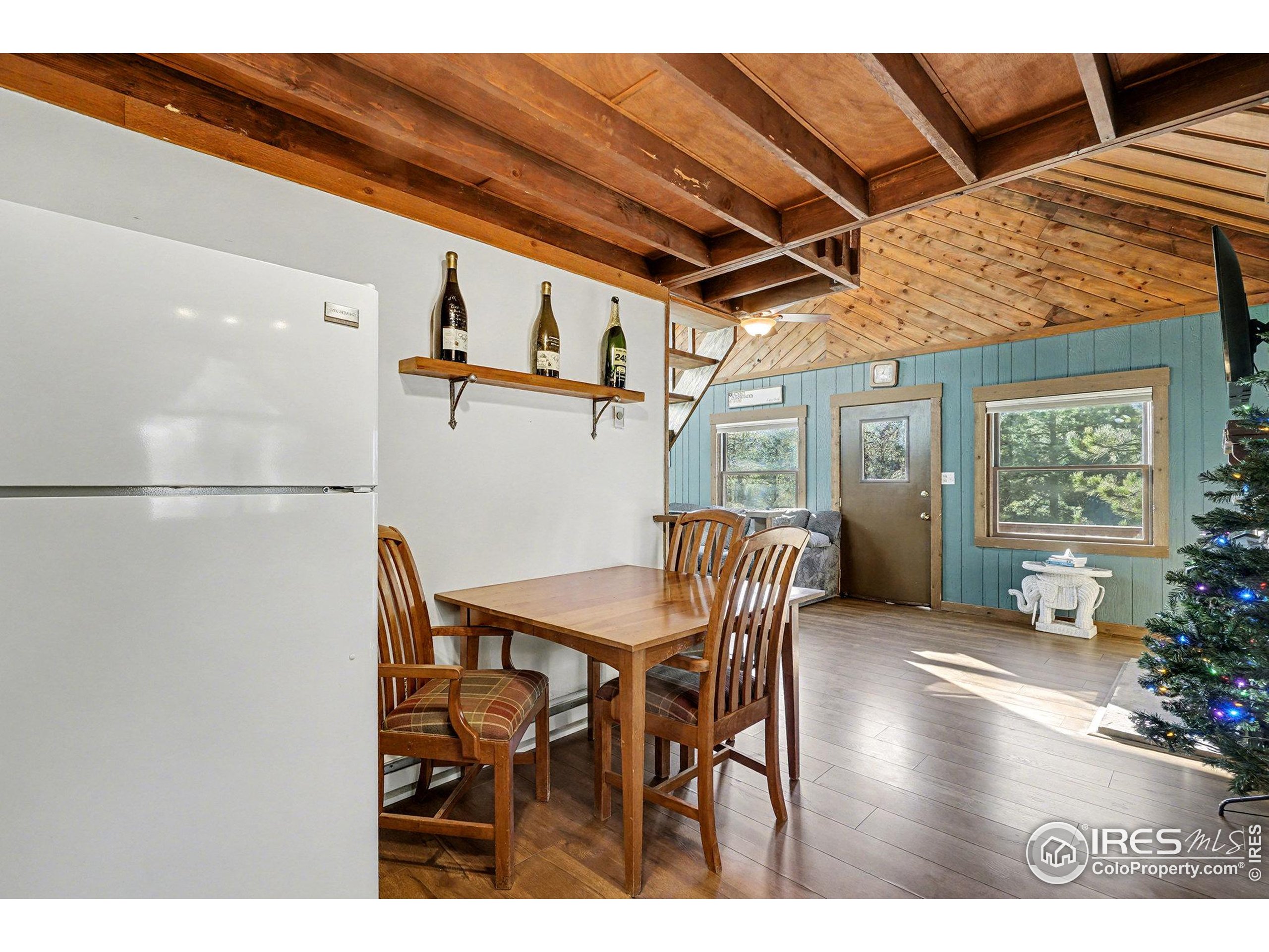 280 Streamside Drive Drake, CO 80515 - Photo 10 of 26 a view of a dining room with furniture and a chandelier