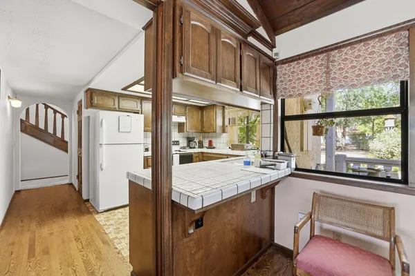 a view of a living room and entry way