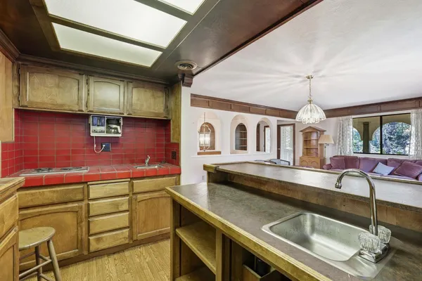 a kitchen that has a lot of cabinets in it