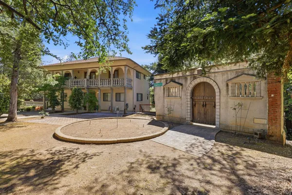 a front view of a house with yard