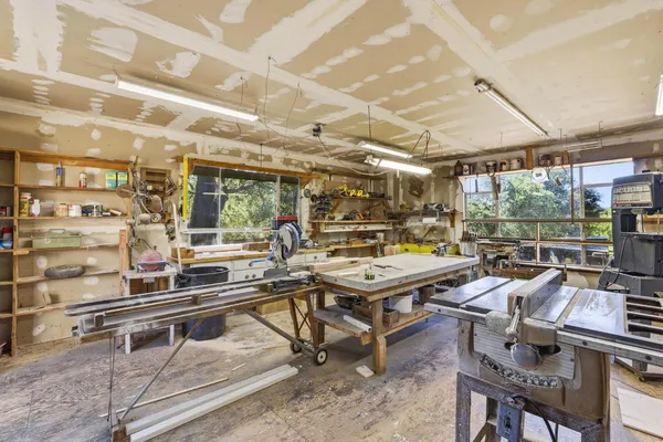 a living room with lots of furniture and a table