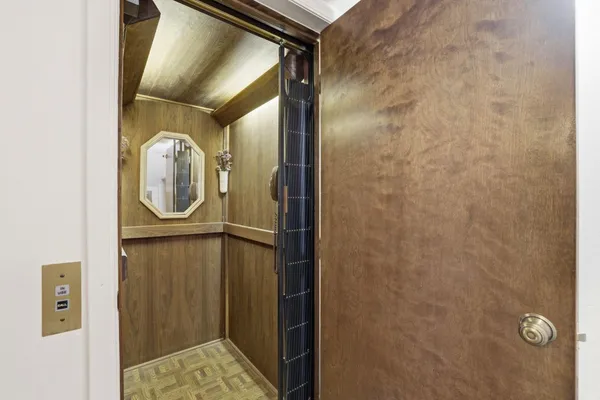 a bathroom with a mirror and a shower