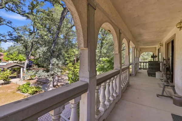 a view of a porch and garden