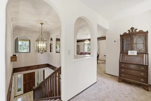 a view of a hallway with windows