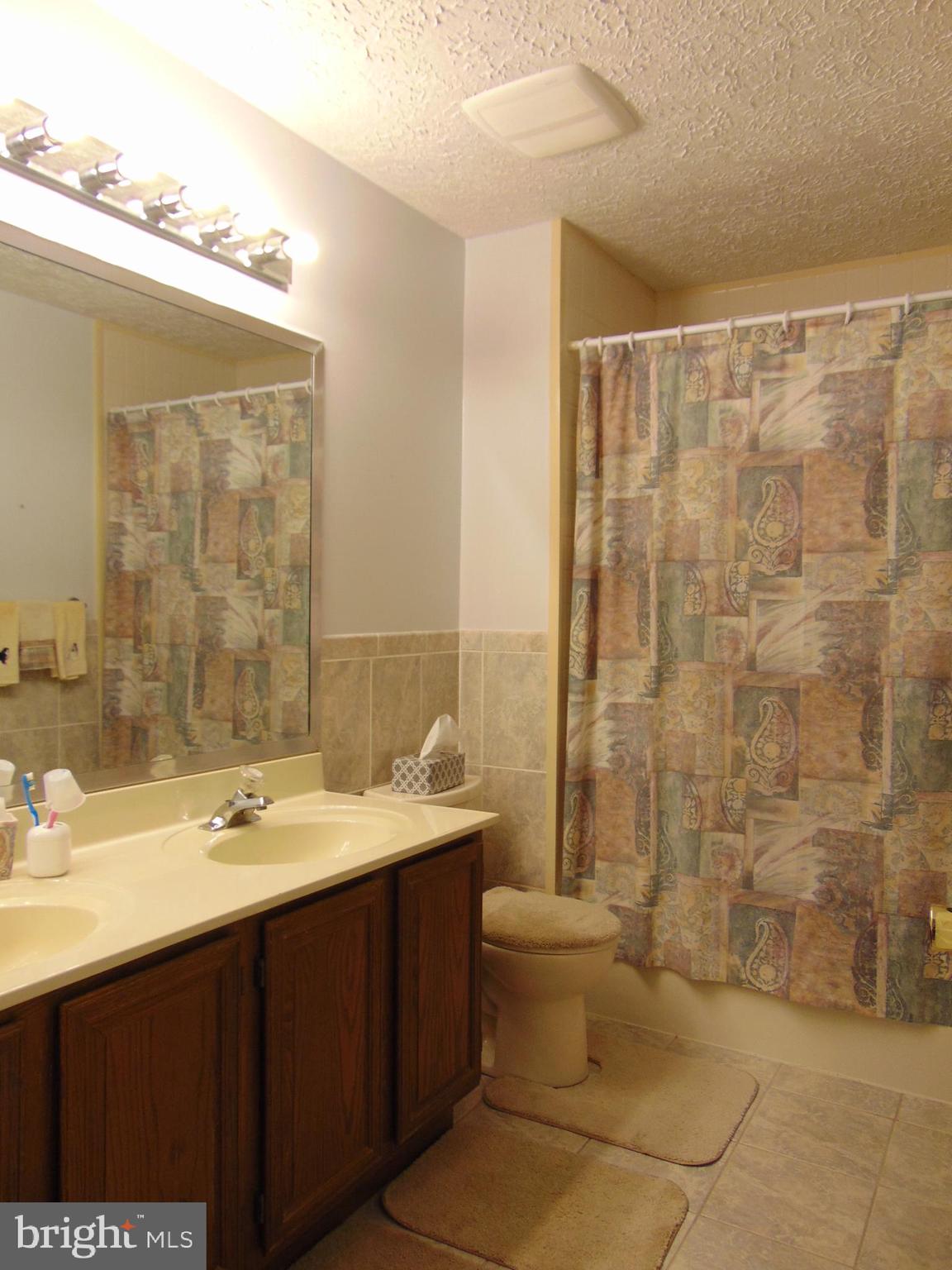 8716 Silver Hall Road Perry Hall, MD 21128 - Photo 11 of 22 Upper Lev Bath~Dual Vaniity~Bath Fitters Tub/Showe