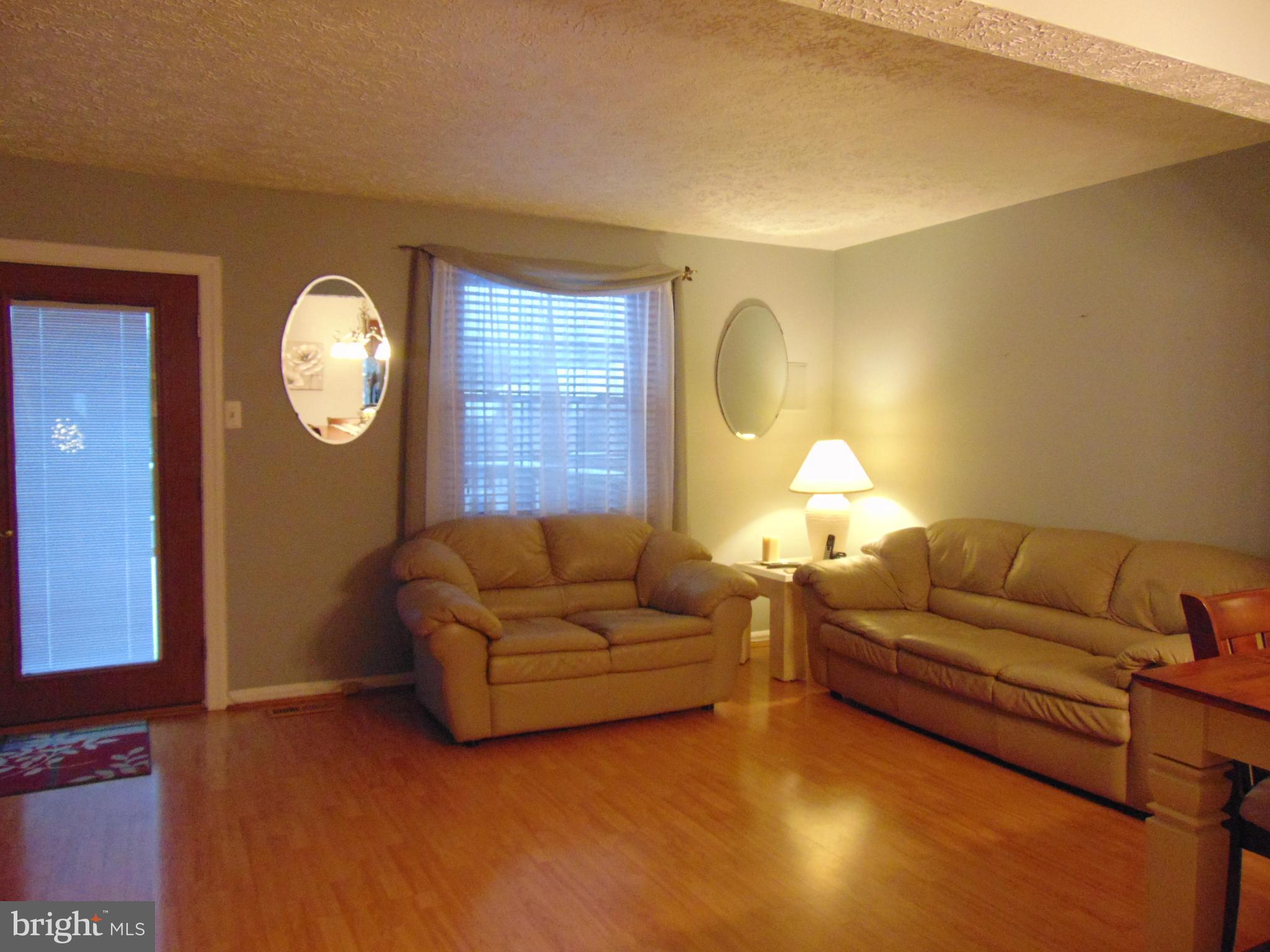 8716 Silver Hall Road Perry Hall, MD 21128 - Photo 9 of 22 Liv Rm affords Gleaming Laminent Wood Floors